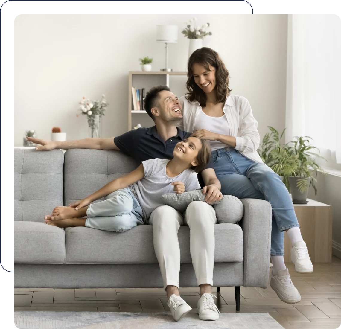 Happy family sitting together on a couch.